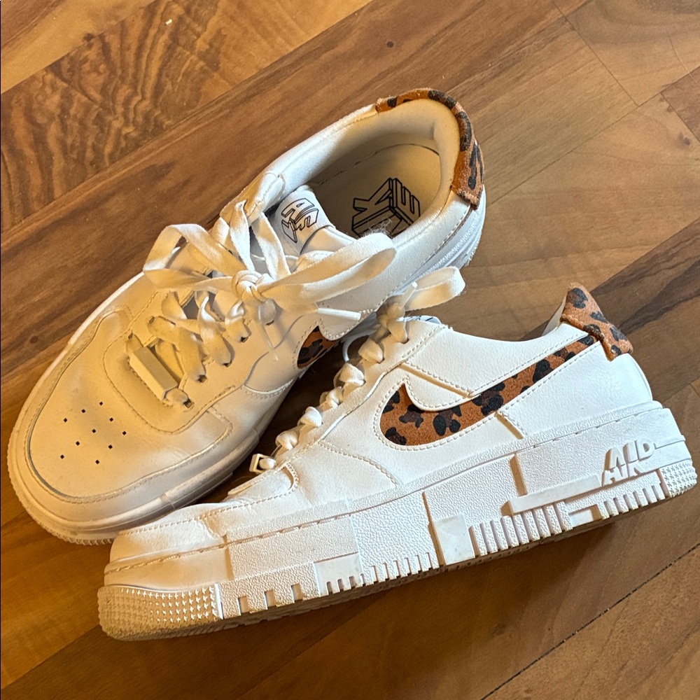 Nike White Sneakers with Leopard Swoosh Accent